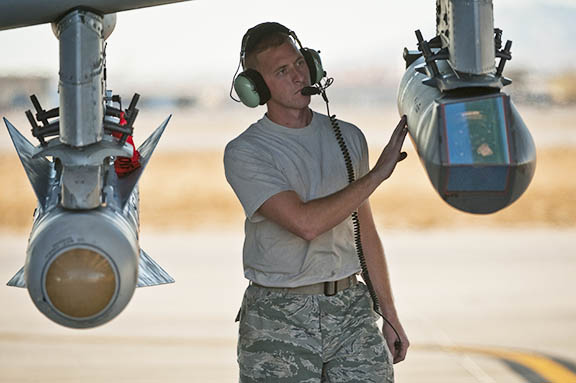 U.S. Air Force Staff Sgt. Jamie Case, a crew chief with the 23rd Aircraft Maintenance Squadron from Moody Air Force Base, Ga., conduct pre-flight checks on a targeting pod attached to an A-10 Thunderbolt II during the Green Flag West 11-2 exercise at Nellis Air Force Base Nev., Dec. 6. Green Flag-West provides a realistic air-land integration training environment for forces preparing to support worldwide combat operations. (U.S. Air Force photo by Tech. Sgt. Michael R. Holzworth/Released)